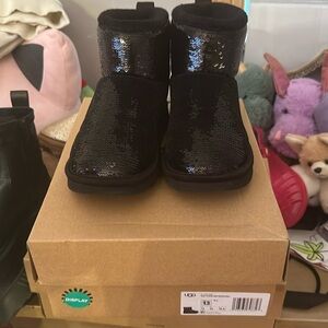 Slight worn girl ugg boots. Size 13C. She out grew them.